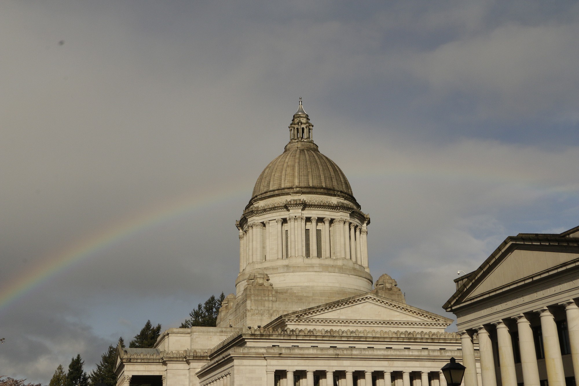 A rainbow is seen behind the Washington state Capitol on Tuesday in Olympia.