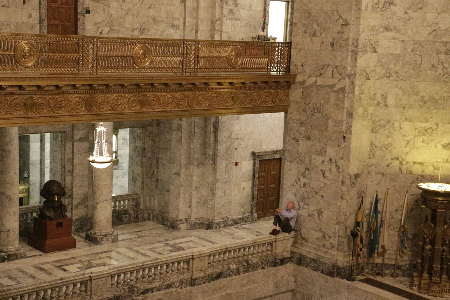 In this picture taken Friday, Democratic Rep. Reuven Carlyle takes a break in the Capitol rotunda from budget negotiations in Olympia.