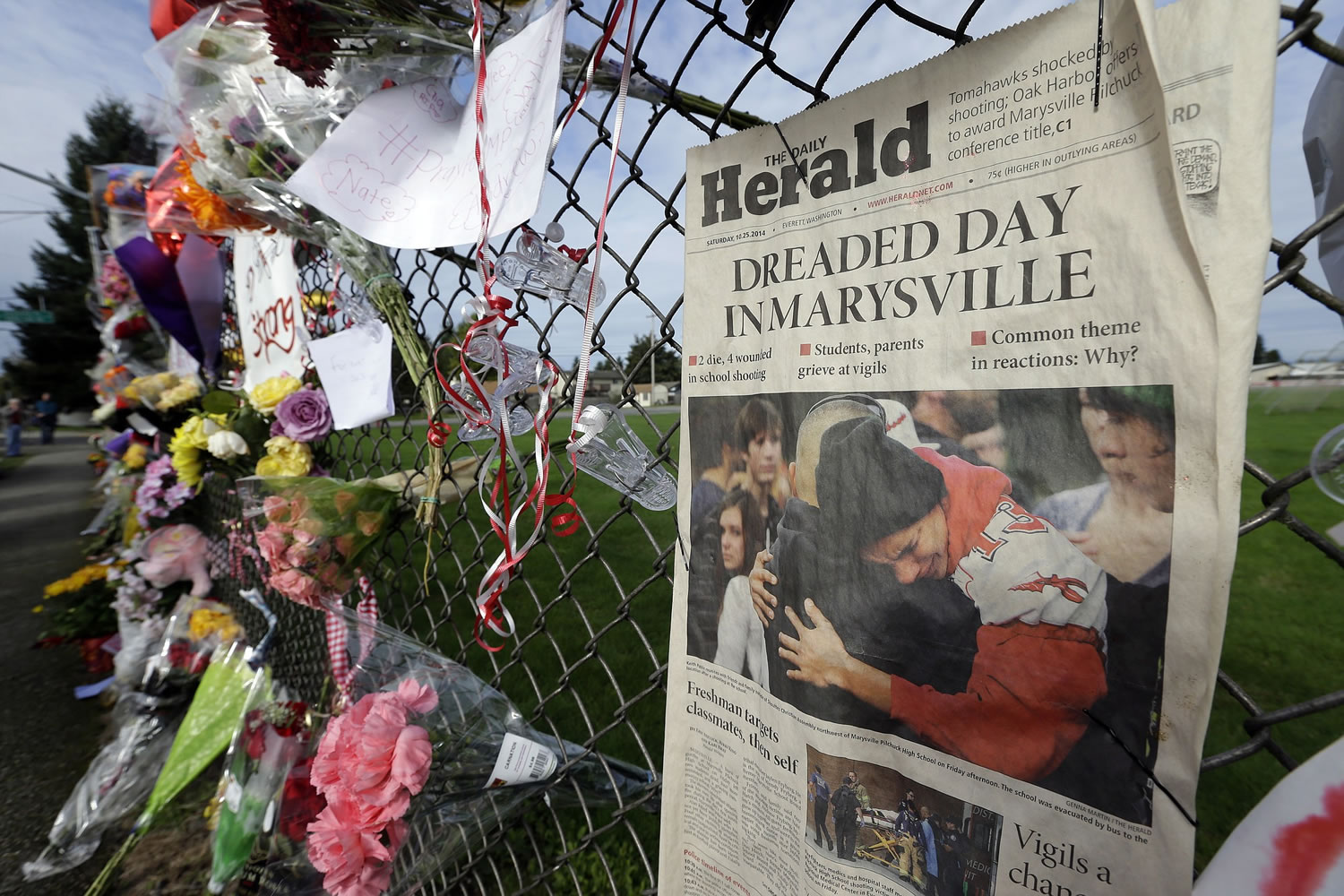 An edition of The Daily Herald from Everett with the headline &quot;Dreaded Day in Marysville&quot; is shown as part of a growing memorial on a fence around Marysville Pilchuck High School in Marysville.