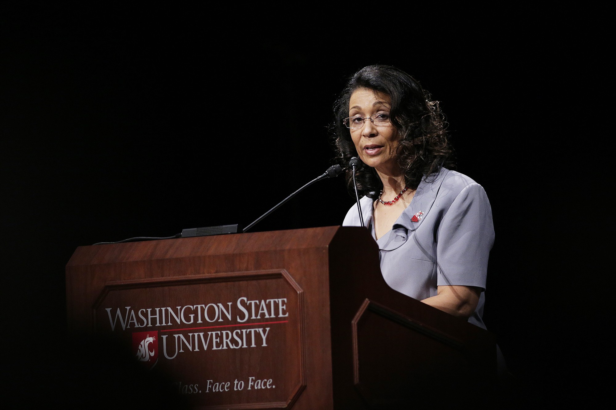 Carmento Floyd speaks Wednesday during a memorial service for her husband and the late Washington State University President Elson Floyd, who passed away in June due to complications from colon cancer, at Beasley Coliseum on the school's campus in Pullman.