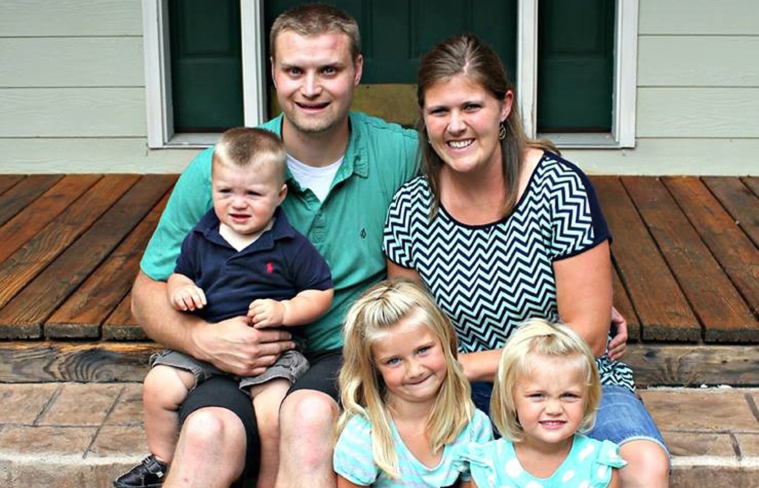 Jake Hanes, with his wife, Melanie Hanes, and their three children, had parts of both of his legs amputated after an accident while chopping down a tree on May 1.