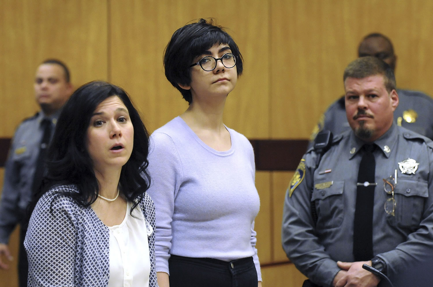 Wesleyan University sophomore Rama Agha Al Nakib, 20, center, stands during her arraignment Wednesday in Middletown, Conn., for possession of controlled substances and other charges.