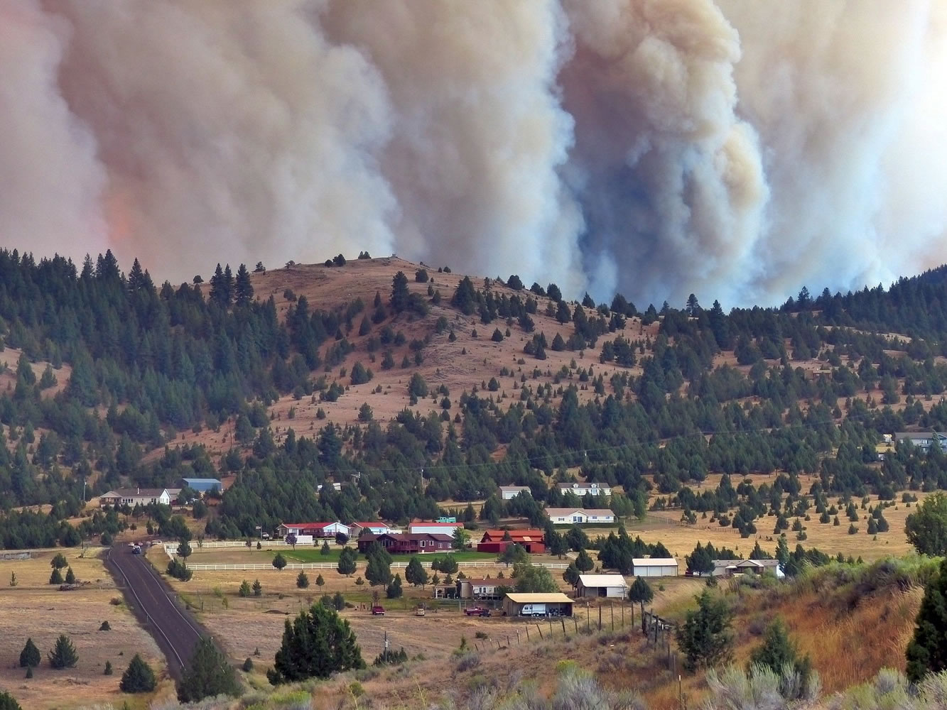 The Canyon Creek Complex fire burns towards a rural subdivision of John Day on Friday.
