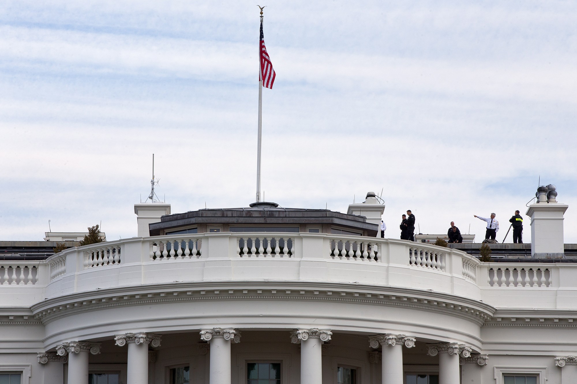 Uniformed Secret Service agents patrol the top of the White House as seen from the South Lawn of the White House in Washington on Tuesday. According to the Secret Service a letter sent to the White House tentatively tested positive for cyanide.