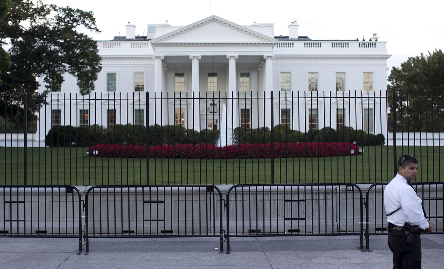 The White House is seen through two layers of fence in Washington on Tuesday.