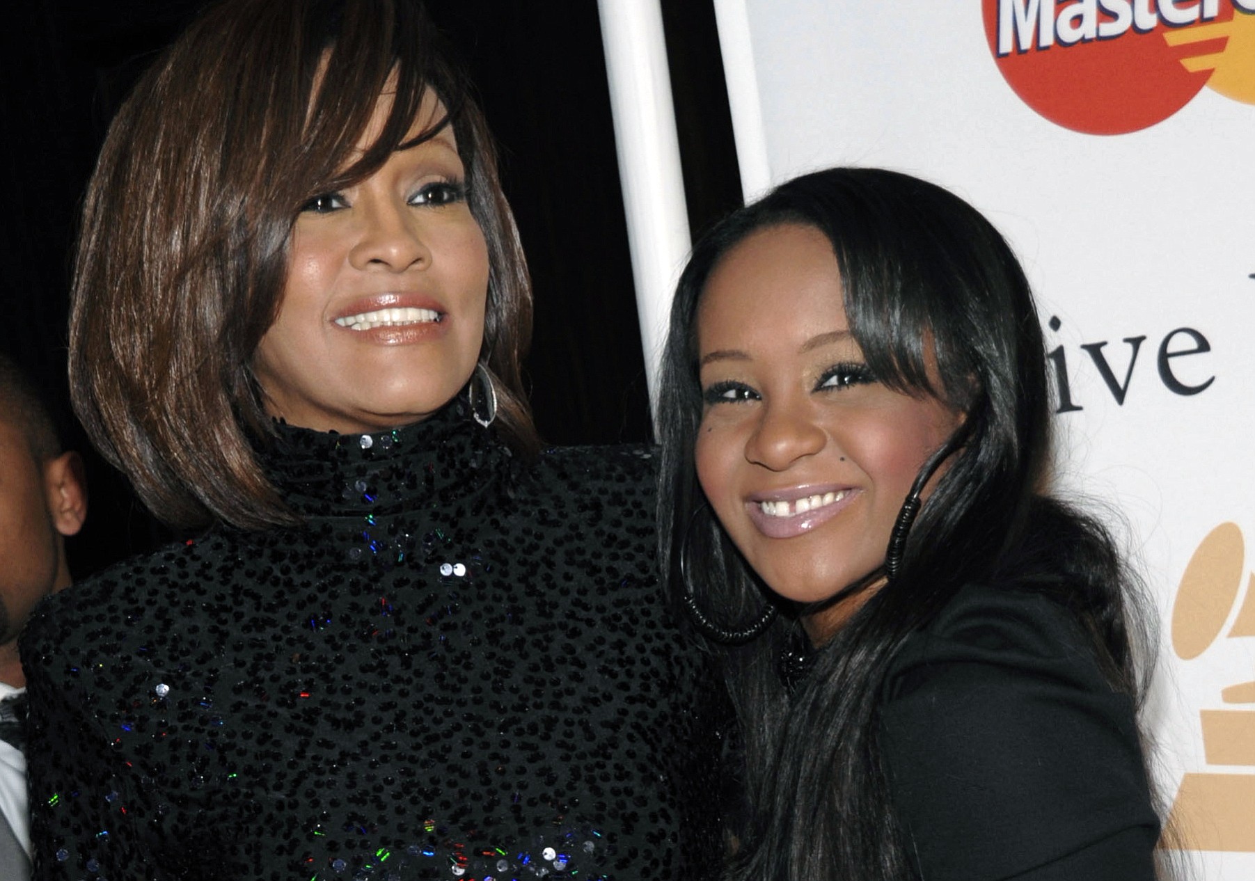 Singer Whitney Houston, left, and daughter Bobbi Kristina Brown arrive Feb. 12, 2011 at an event in Beverly Hills, Calif. The daughter of late singer and entertainer Whitney Houston was found Saturday unresponsive in a bathtub by her husband and a friend and taken to an Atlanta-area hospital.
