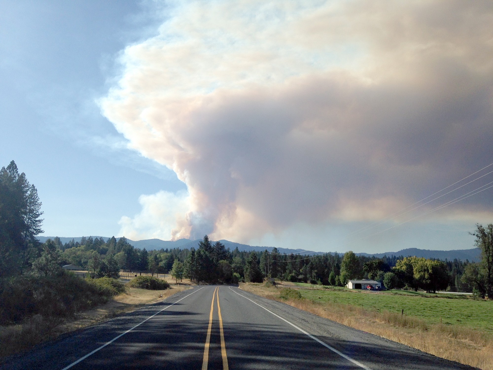 In this Sept. 14, 2014, file photo, a plume of smoke churns out of the Onion Mountain fire in the Rogue River-Siskiyou National Forest 15 miles west of Grants Pass, Ore.