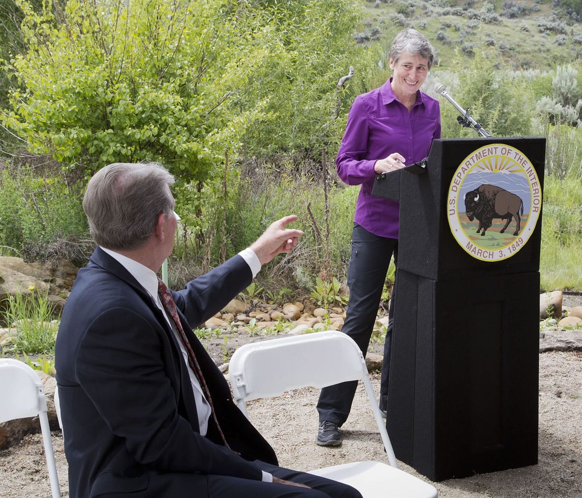 U.S. Secretary of the Interior Sally Jewell, right, smiles towards Idaho Gov. Butch Otter during a news conference Tuesday in Boise, Idaho.