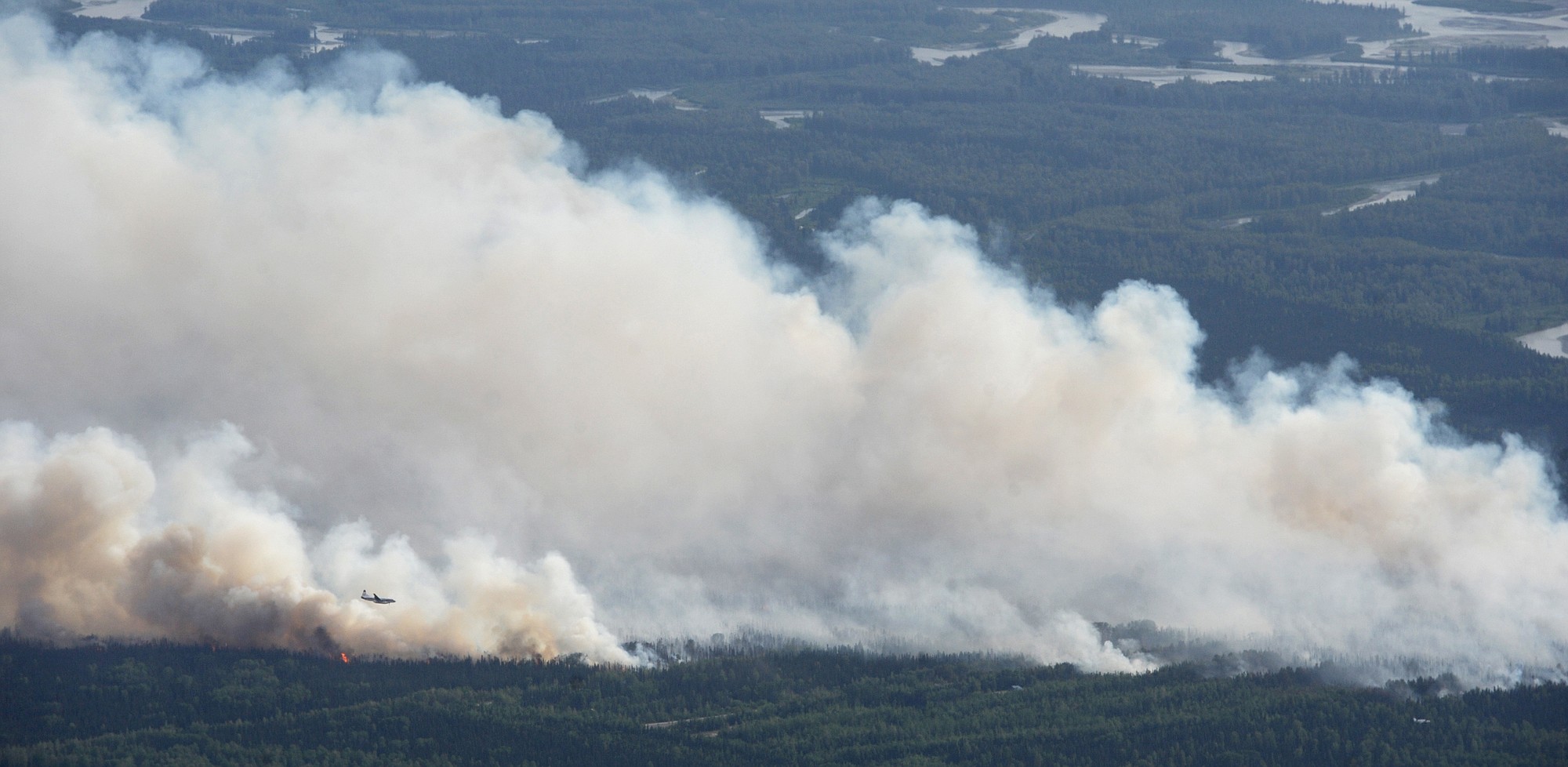 Bill Roth/Alaska Dispatch News
An Alaska State Division of Forestry air tanker works the Sockeye fire, north of Kashwitna Lake, on Sunday near Willow, Alaska. The wildfire north of Anchorage closed a key highway and forced the evacuation of 1,700 homes.