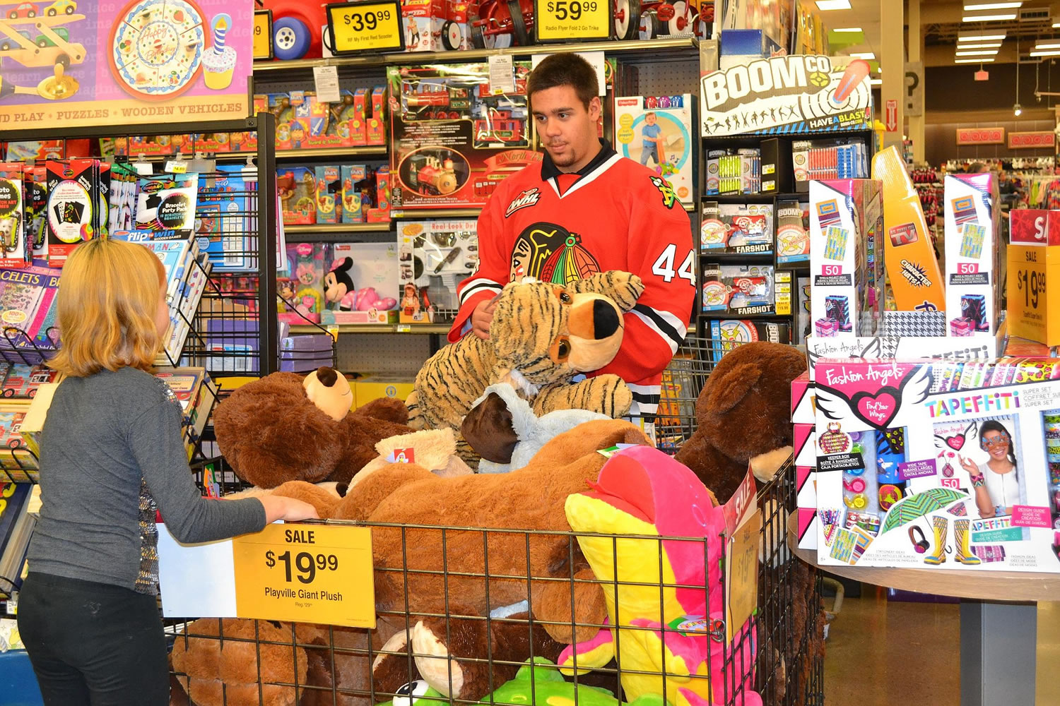 Winterhawks defenseman Keoni Texeira was one of several Winterhawks players who recently shopped for toys and clothes with 25 students from Portland's Lincoln Park Elementary School.