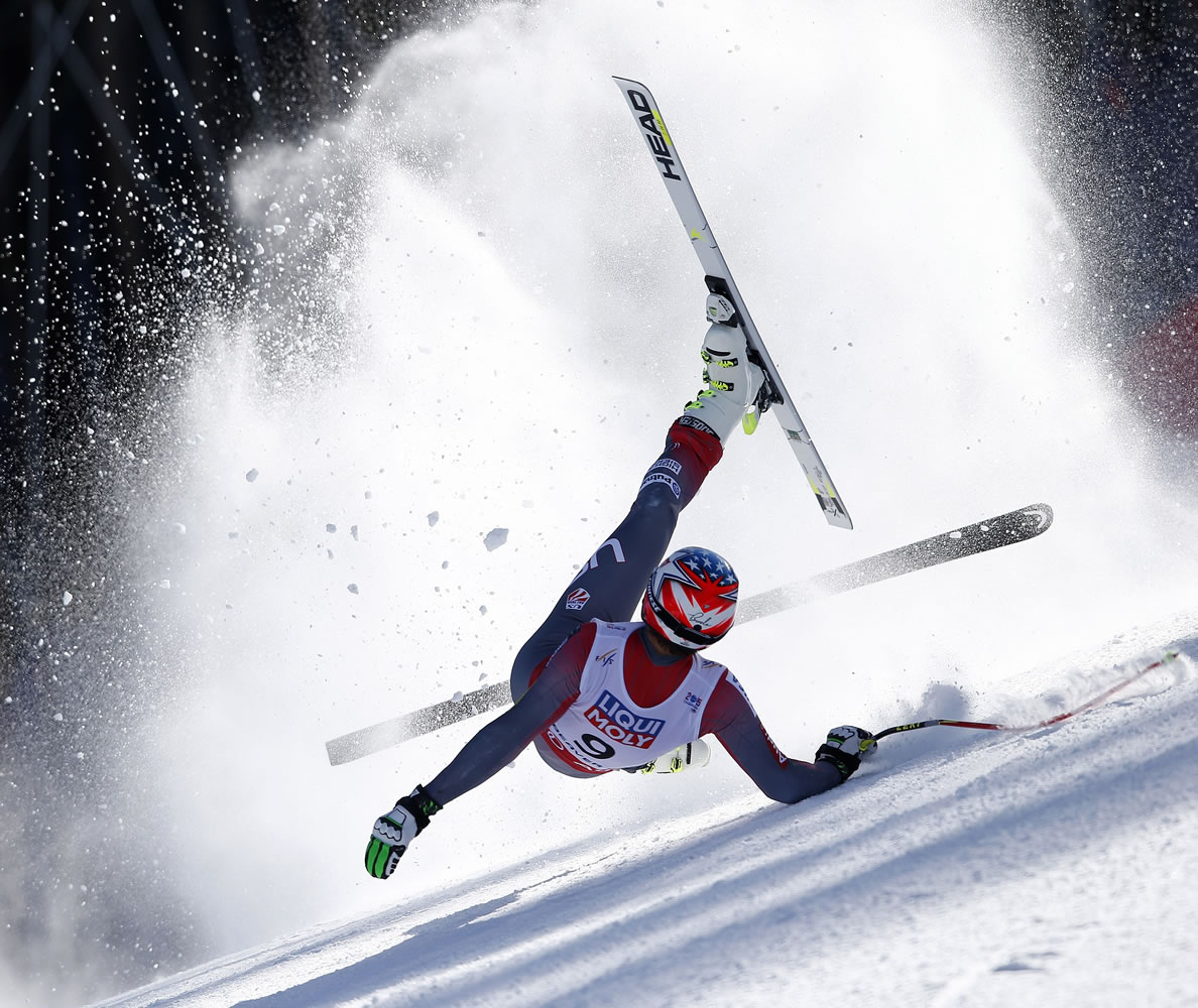 United States' Bode Miller crashes during the men's super-G competition at the alpine skiing world championships, Thursday, Feb. 5, 2015, in Beaver Creek, Colo. Miller did not finish the race.