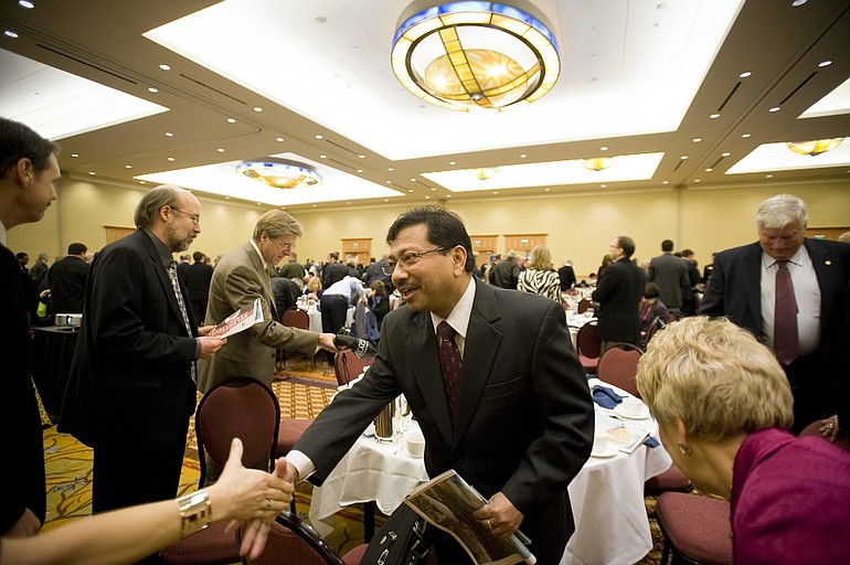 Economist Arun Raha greets the crowd after giving the keynote address at the 2010 Economic Forecast Breakfast at the Hilton Vanocuver Washington, Friday