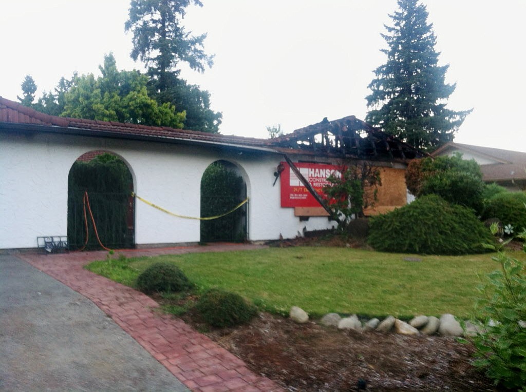 Two people have been arrested in conjunction with the July 5 fire that destroyed this Felida home.