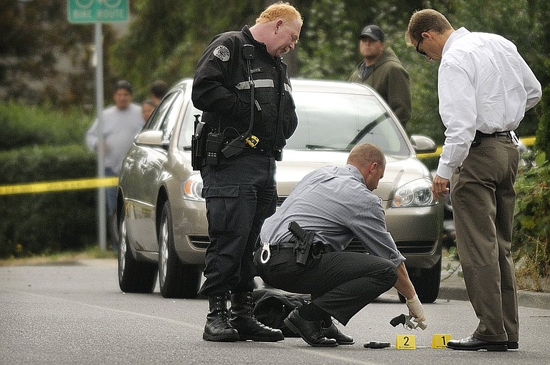 Vancouver police investigate the scene of a shooting Thursday at 3512 E. McLoughlin Blvd.