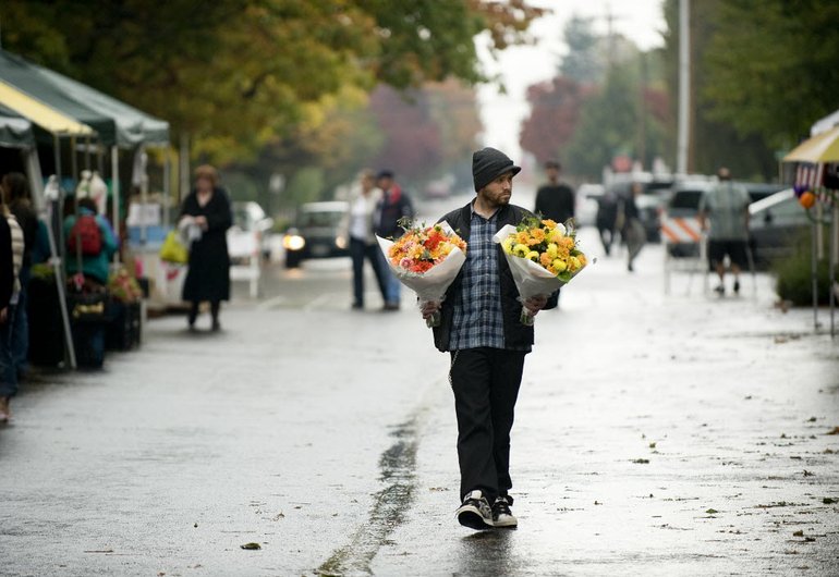 Jason Goff of Vancouver's Hudson's Bay neighborhood bought flowers at the Vancouver Farmers Market on Sunday to give as gifts to visiting family members.
