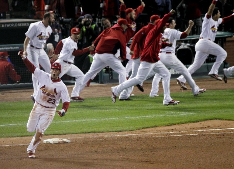 St. Louis Cardinals' David Freese reacts after hitting a solo home run off the Texas Rangers' Mark Lowe in the 11th inning of Game 6 of baseball's World Series on Thursday in St. Louis.