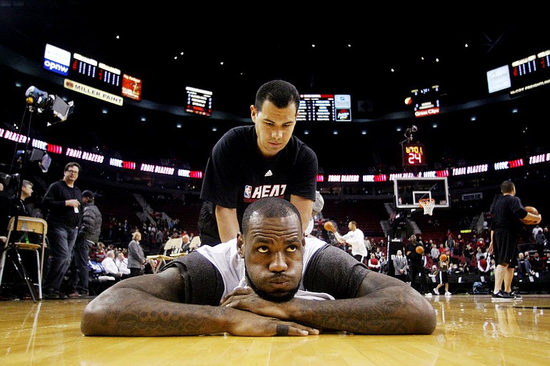 Miami Heat's LeBron James stretches before Thursday's game against the Portland Trail Blazers at the Rose Garden.