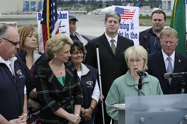 Washington Gov. Chris Gregoire, left, looks on as Sen. Patty Murray, D-Wash., second from right, speaks Monday near Boeing Co.'s assembly plant in Everett. Murray, Gregoire, and other officials were promoting the potential economic and employment benefits to Washington state and the U.S. if  Boeing's next-generation tanker, based on the company's 767 airplane, is selected as the U.S.