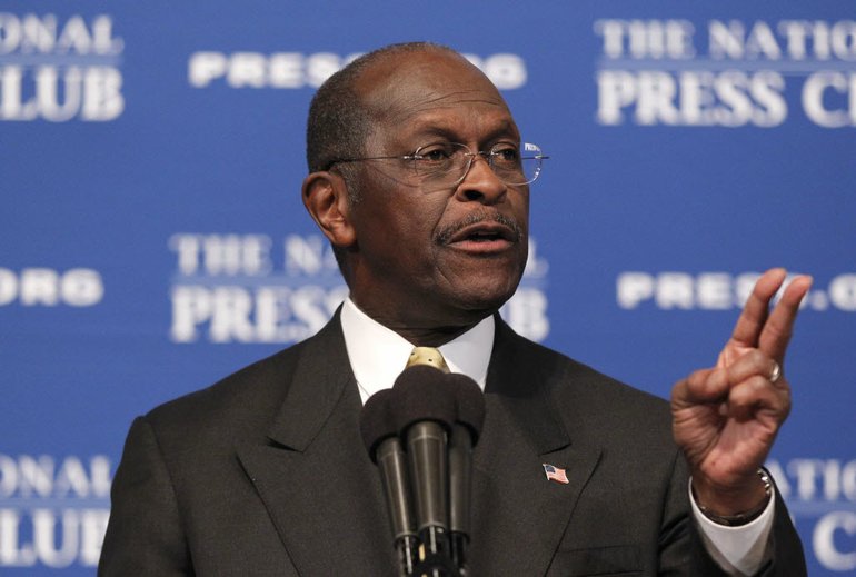 Republican presidential candidate, Herman Cain answers questions at the National Press Club in Washington on Monday.