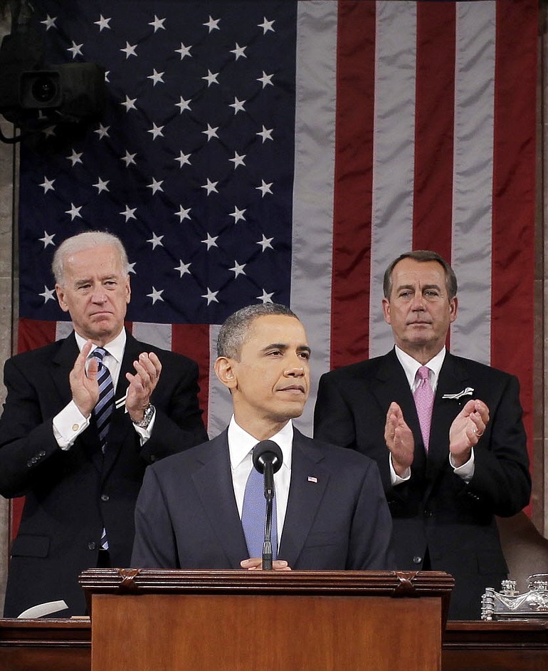 President Barack Obama is applauded by House Speaker John Boehner of Ohio and Vice President Joe Biden while delivering his State of the Union address Tuesday.