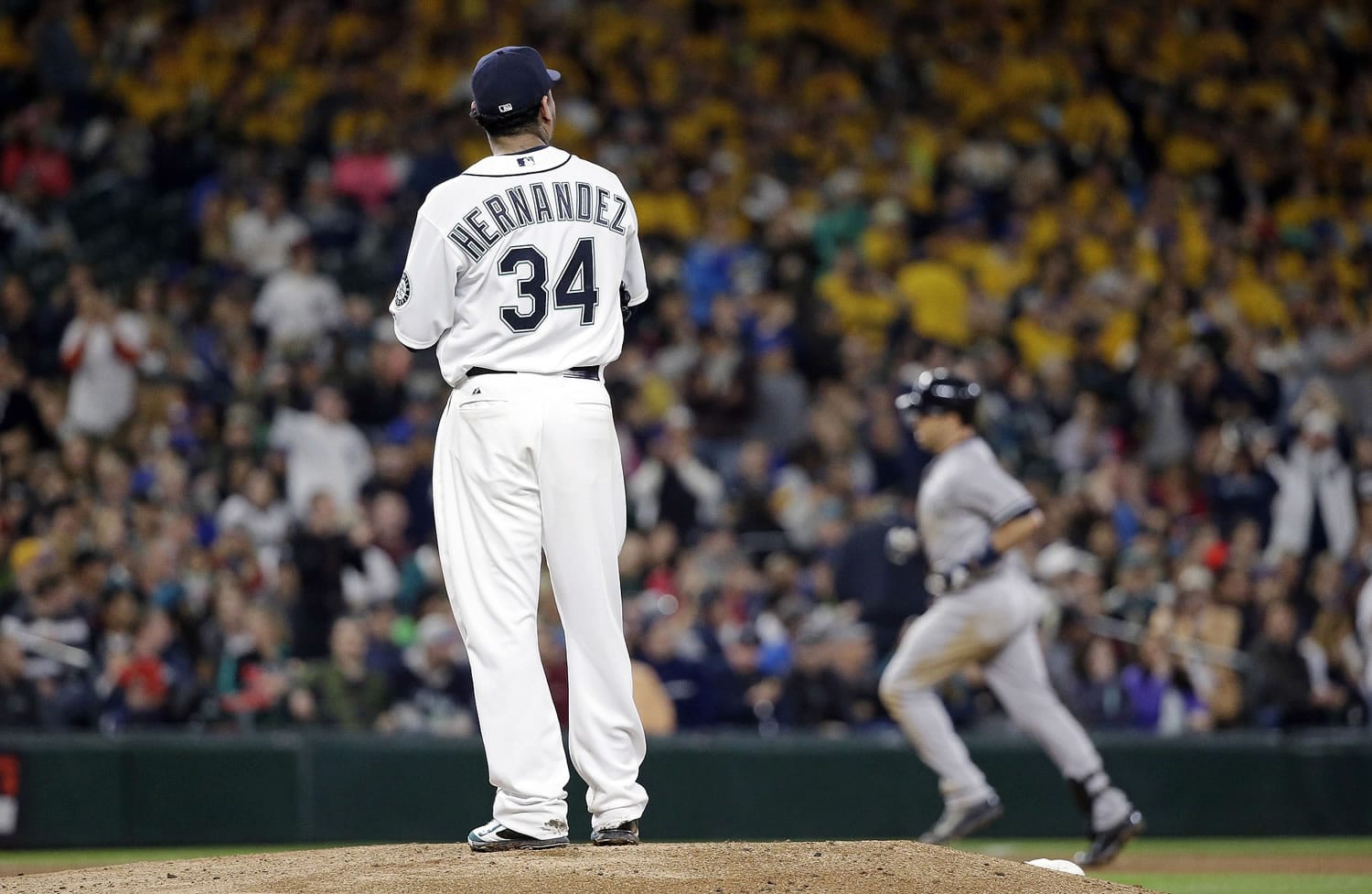 Felix Hernandez (34) watches as New York's Mark Teixeira rounds the bases on a grand slam in the fifth inning.