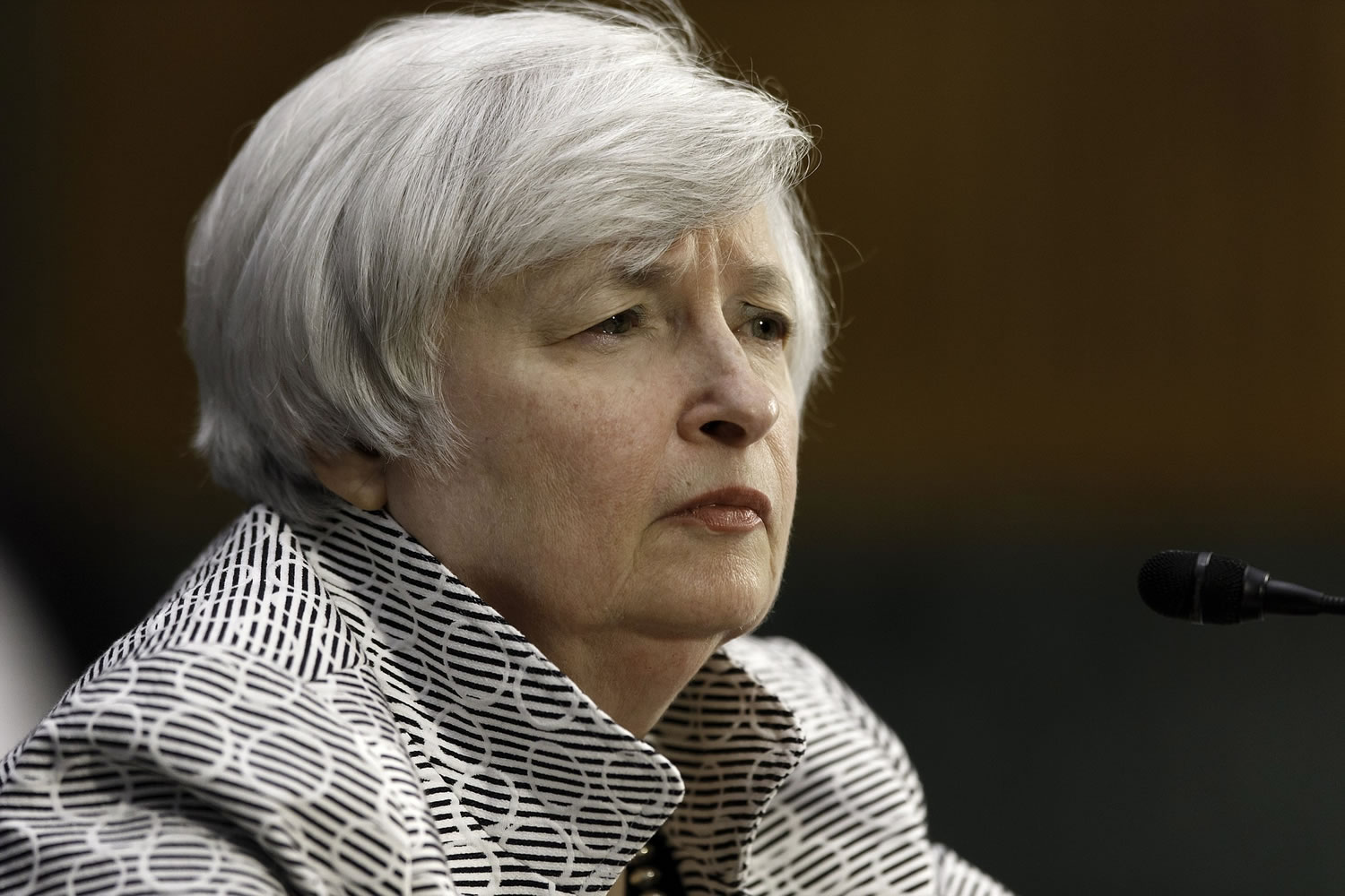 Federal Reserve Chair Janet Yellen listens Tuesday as she testifies on Capitol Hill in Washington before  the Senate Banking Committee.