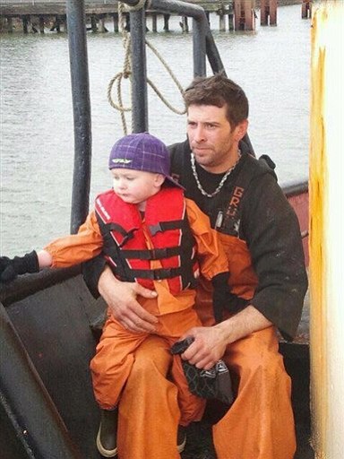 This 2011 photo provided by Adam Bjaranson shows Jason Bjaranson with his son. Jason Bjaranson knew the perils of the life he had chosen as a commercial fisherman in the Pacific Ocean. He practiced the life-or-death task of getting into his survival suit so he could do it in 13 seconds.