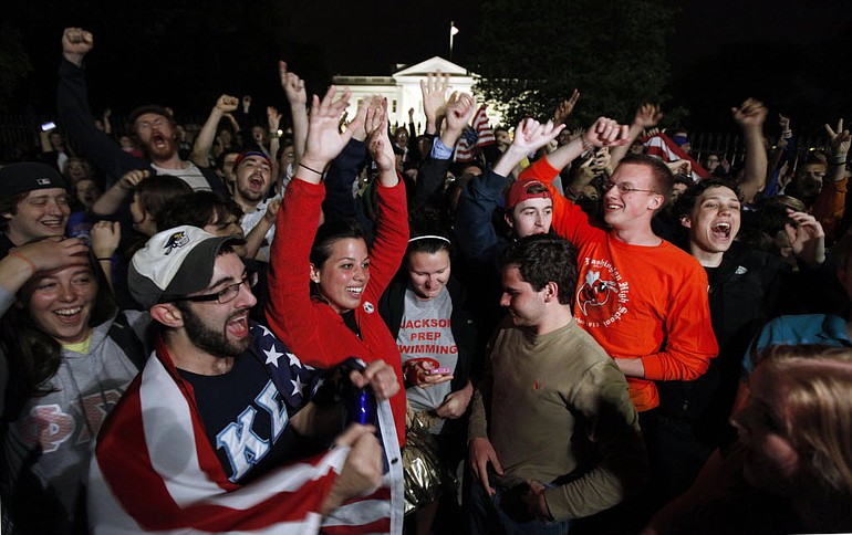Crowds outside the White House react late Sunday to the news that terror mastermind Osama bin Laden has been killed by U.S.