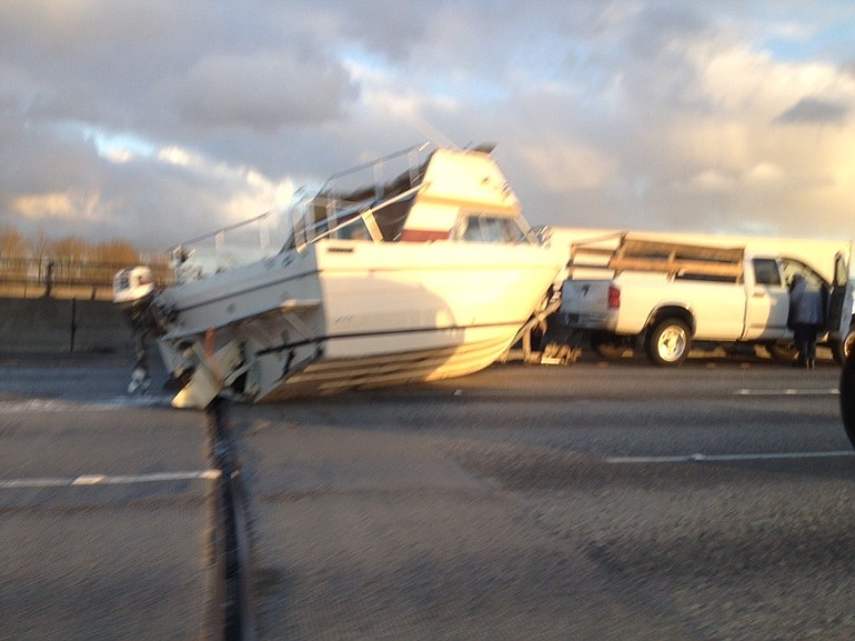 A Columbian.com reader captured this image of a boat that fell off it's trailer Thursday afternoon in the southbound lanes of Interstate 205 at the Glenn Jackson Bridge.
