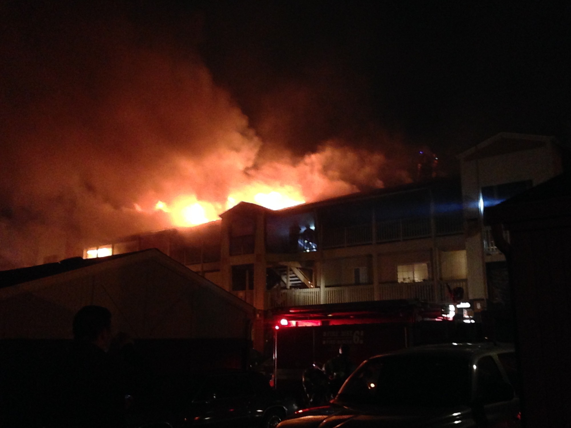 Flames lick from Building M at the Bridge Creek Apartments this morning.