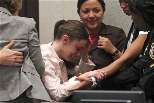 Casey Anthony reacts to being acquitted of her young daughter's murder.