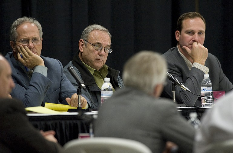 Clark County Commissioners, from left, Marc Boldt, Tom Mielke and Steve Stuart, listen to BPA Administrator Steve Wright during a meeting last year.