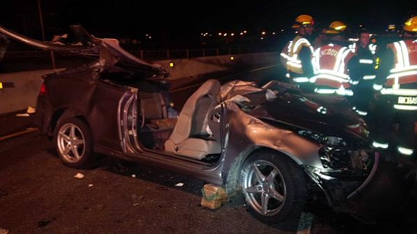 Four people were injured Friday night when a car crashed into a concrete barrier on Saint Johns Boulevard at the westbound onramp to state Highway 500.