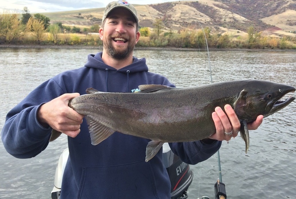 Ethan Crawford of Moscow, Idaho, hold a 9.4-pound coho taken in the state's first coho season.