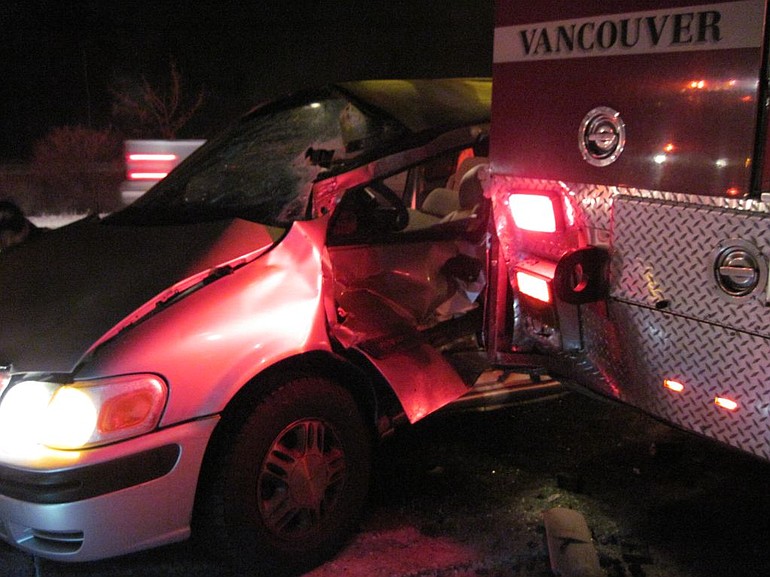 Slick roads contributed to this accident early New Year's Eve on Interstate 205 in which a minivan collided with Vancouver Fire Department's Truck 6.