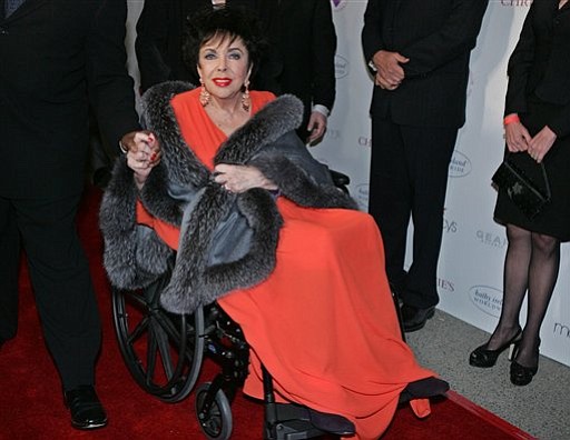 In this Dec. 1, 2007 file photo, Elizabeth Taylor arrives at Paramount Studios in the Hollywood section of Los Angeles to give a benefit performance of A.R. Gurney's play &quot;Love Letters&quot; for the Elizabeth Taylor HIV/AIDS Foundation. Publicist Sally Morrison says the actress died Wednesday, March 23, 2011 in Los Angeles of congestive heart failure at age 79.