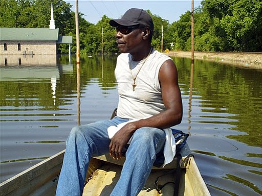 William Jefferson rides about around his Vicksburg, Miss. neighborhood Tuesday, May 10, 2011. Jefferson's house was under at least 3 feet water, as were dozens of other homes in the neighborhood.