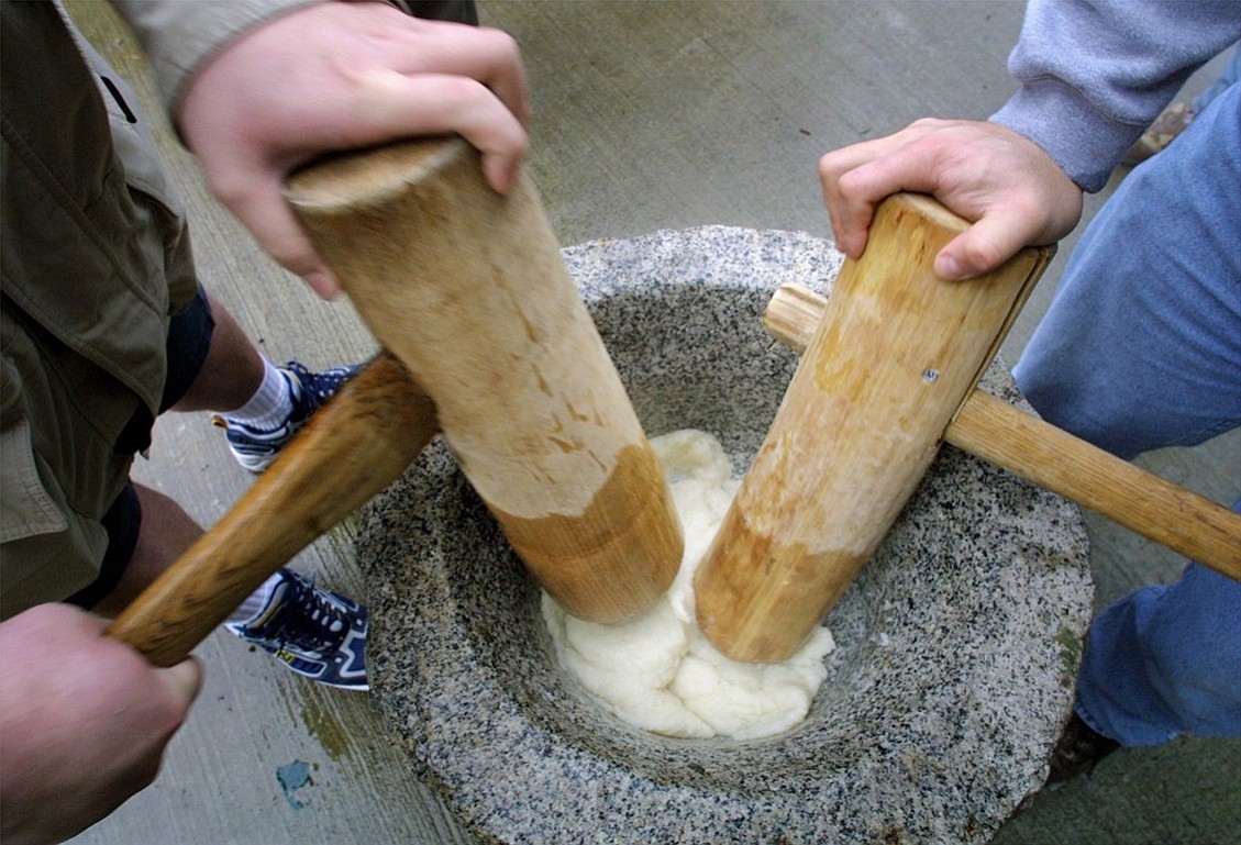 (AP Photo/The Seattle Times, Alan Berner)
Rice is pounded in a large stone bowl to create mochi. The tradition will be part of Mochitsuki 2015 held Jan. 25 at Portland State University.