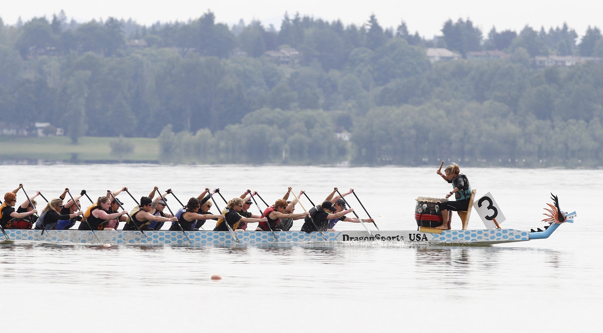 Dragon boat race participants near finish line at the Paddle for Life dragon boat festival at Vancouver Lake last year.