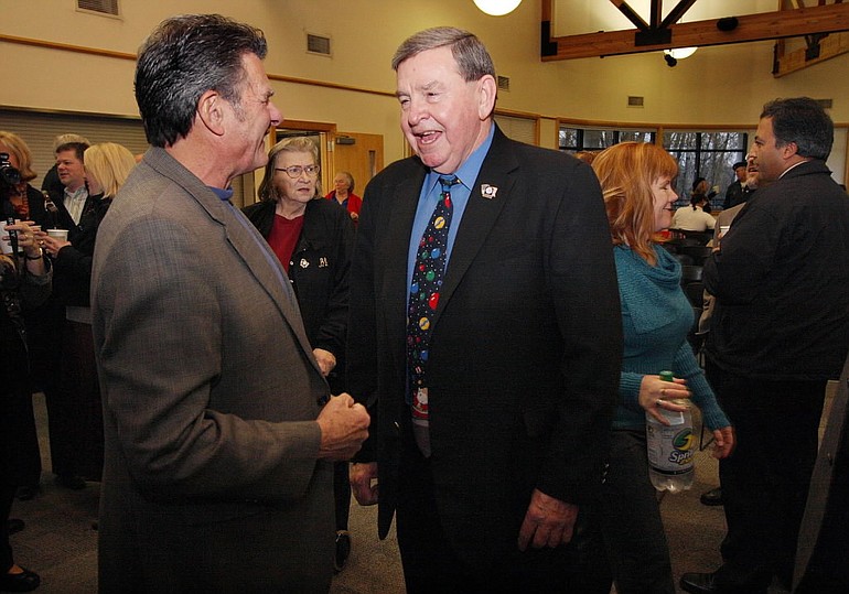 Ridgefield Mayor Ron Onslow, left, joined close to 200 others who thanked outgoing Vancouver Mayor Royce Pollard, right, for his 20 years of service Wednesday at the Water Resources Education Center.