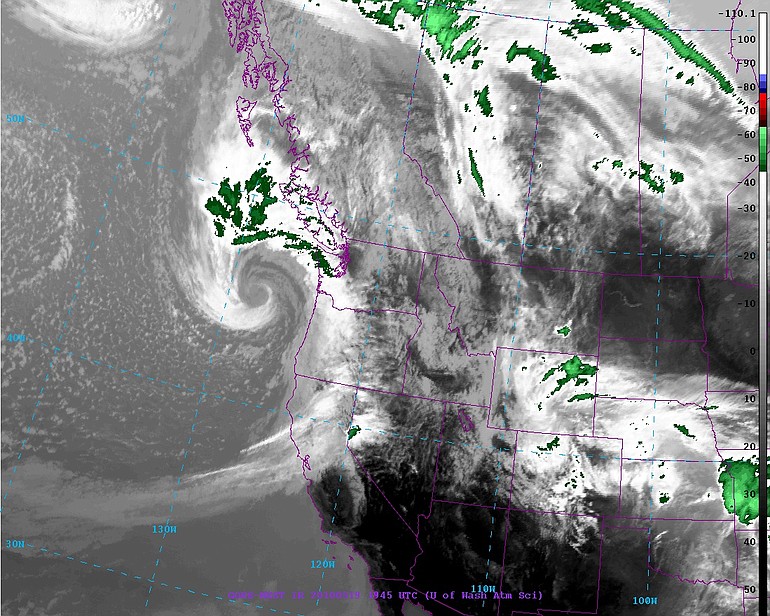 A satellite photo shows a storm system poised to move onshore.