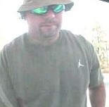 Law enforcement officials have released this photo of a man they suspect of stealing bank card numbers and PIN's using an ATM skimming device.