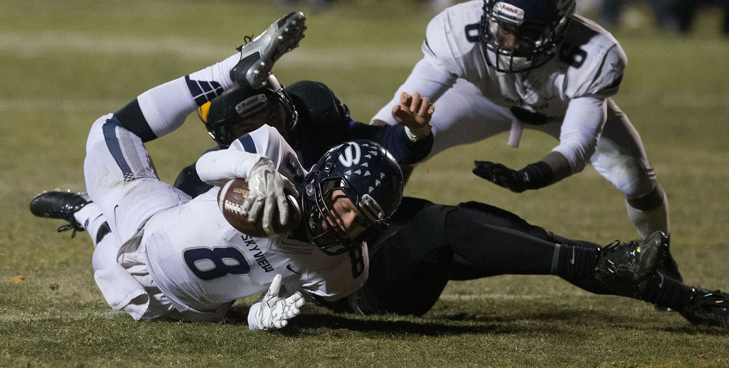 Skyview quarterback Zac Shomler stretches for extra yards during the Storm's 41-27 loss to Wenatchee.