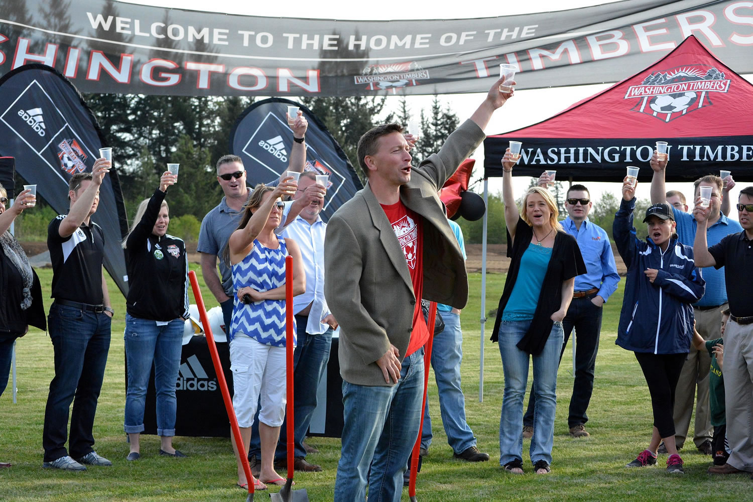 Sean Janson, executive director of Washington Timbers FC, toasts to the start of construction of two artificial turf fields at the Harmony Sports Complex. The club marked the start of construction with a celebration on Friday.