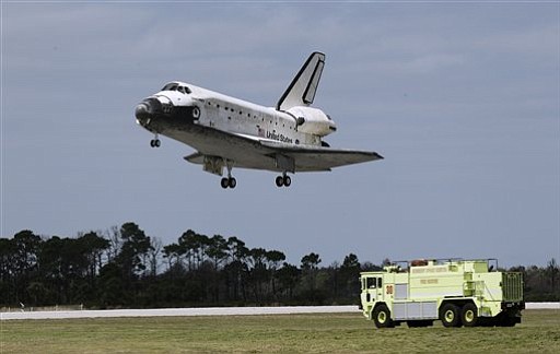 Space shuttle Discovery touches down for the final time at the John F. Kennedy Space Center in Florida Wednesday.