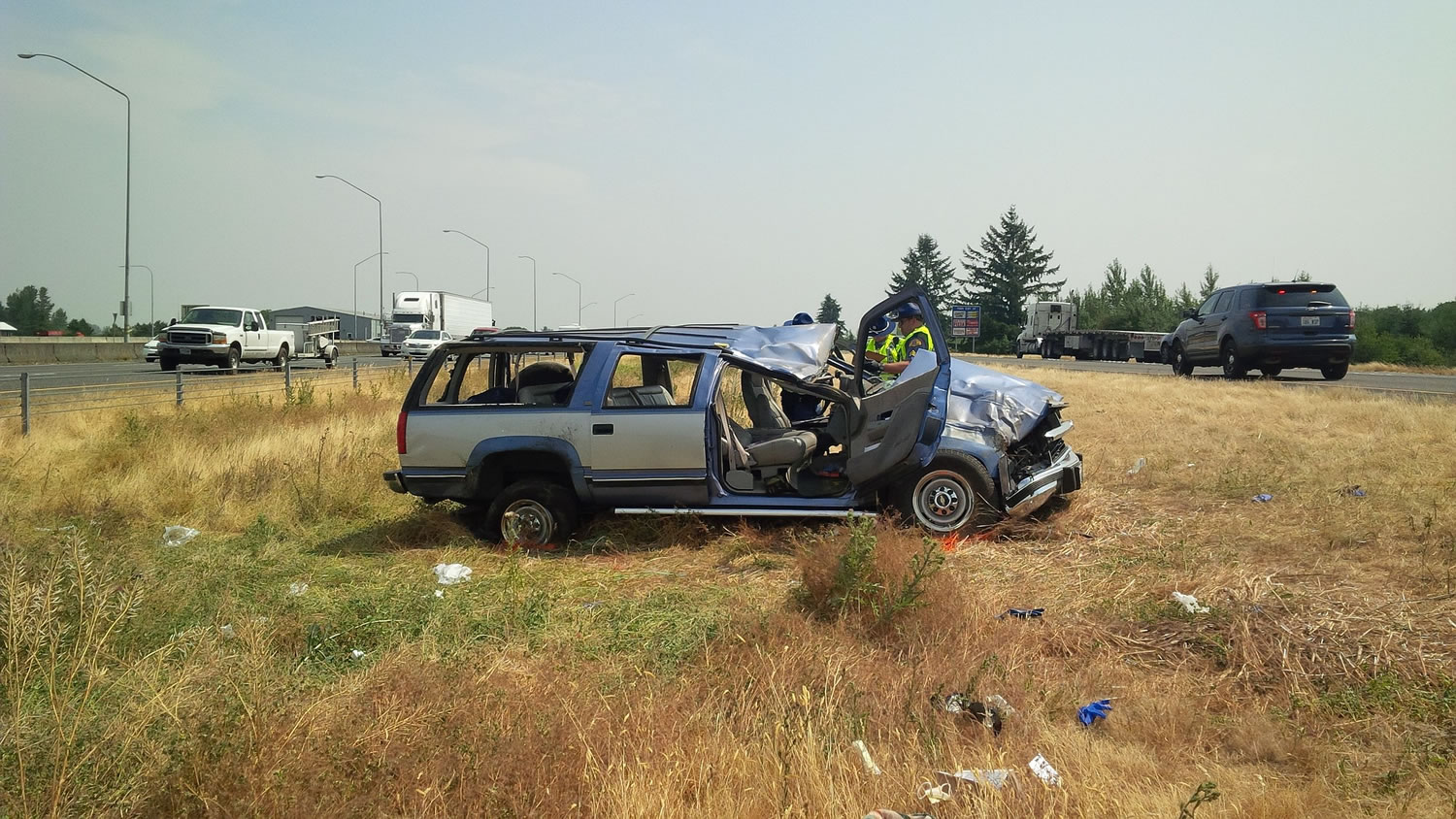 Washington State Patrol troopers investigate a single-car crash in the median of Interstate 5 near the Ridgefield Port of Entry.