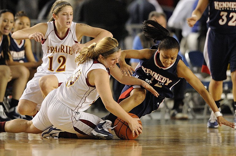 Angela Gelhar, 10, of Prairie High School steals the ball away from Jasmine Lemon, 12, of Kennedy Catholic during the second half Thursday March 3, 2011 at the WIAA girls 3A State Basketball Championships at the Tacoma Dome in Tacoma, Washington. Gelhar scored 16 points and had 2 steals in the game. The Falcons beat the Lancers 46-40.