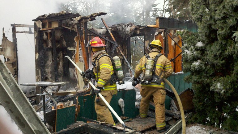 Firefighters responded to a fire at a home in Battle Ground that investigators later deemed a total loss.
