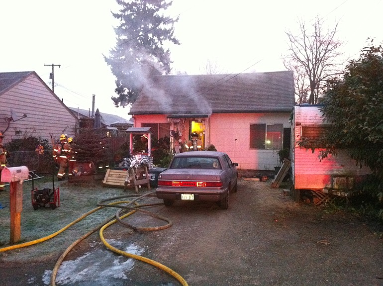 The Vancouver Fire Department responded to a fire contained inside the walls of a Rose Village neighborhood home.