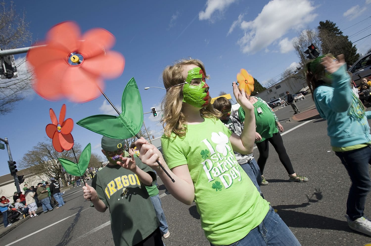 Olivia Barber, 11, a fifth-grader at Hough Elementary, makes her way down Main Street during the 19th Annual Paddy Hough Parade on St.